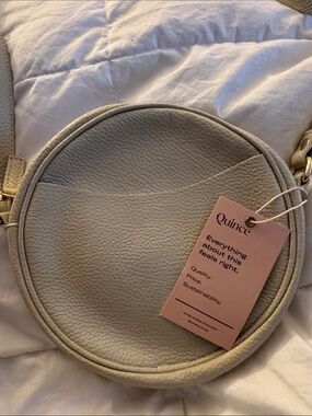 Quince round leather crossbody.